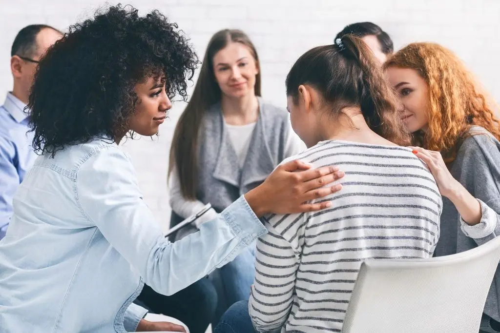 Addiction recovery coaching in a group setting with peer support